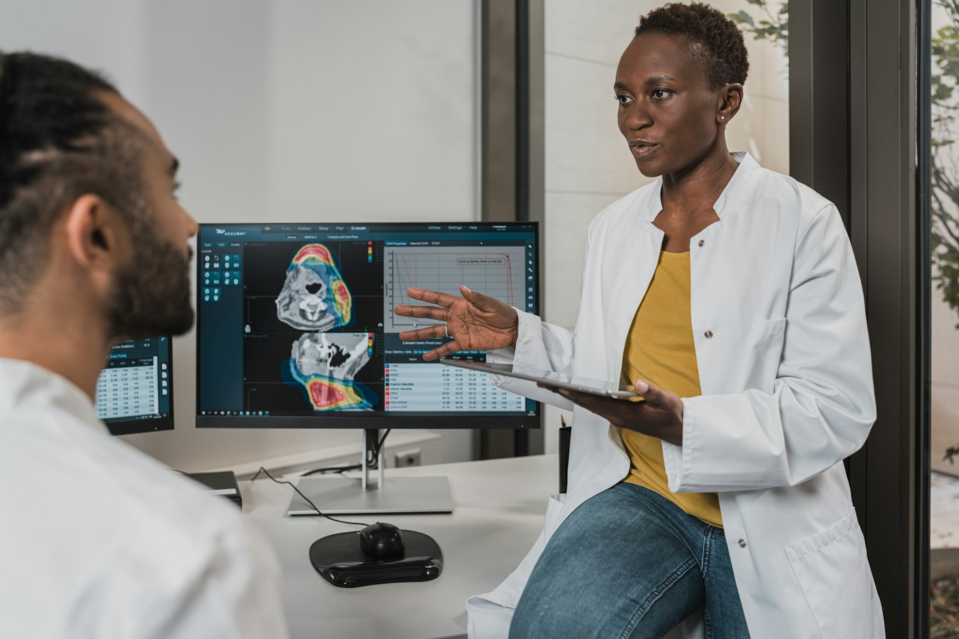 Two clinicians reviewing a scan together